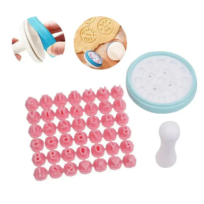 Pink and blue decorbites cookie stamps set with pink plastic alphabet and symbol cutters and a light blue base