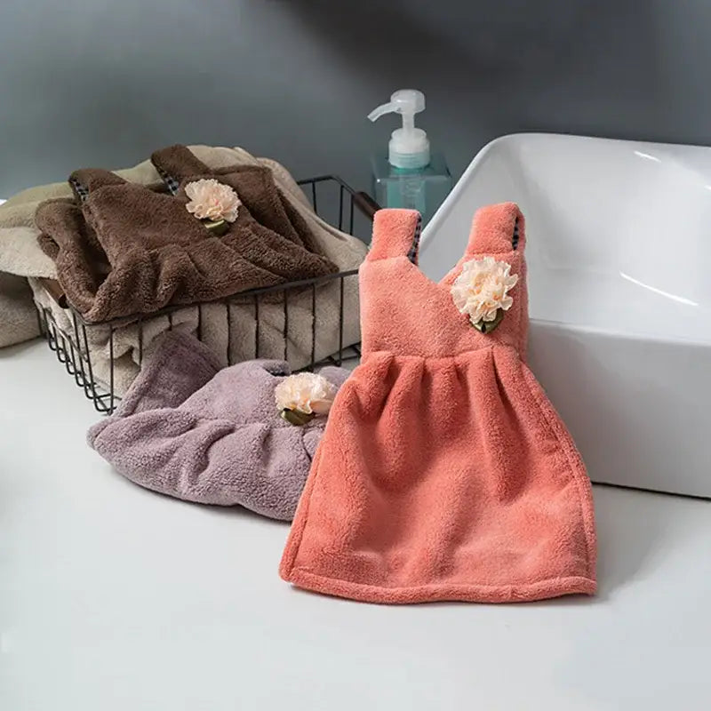 Coral-colored plush hand towel dress with peach flower embellishment for decorbites kids cute kitchen and bathroom use