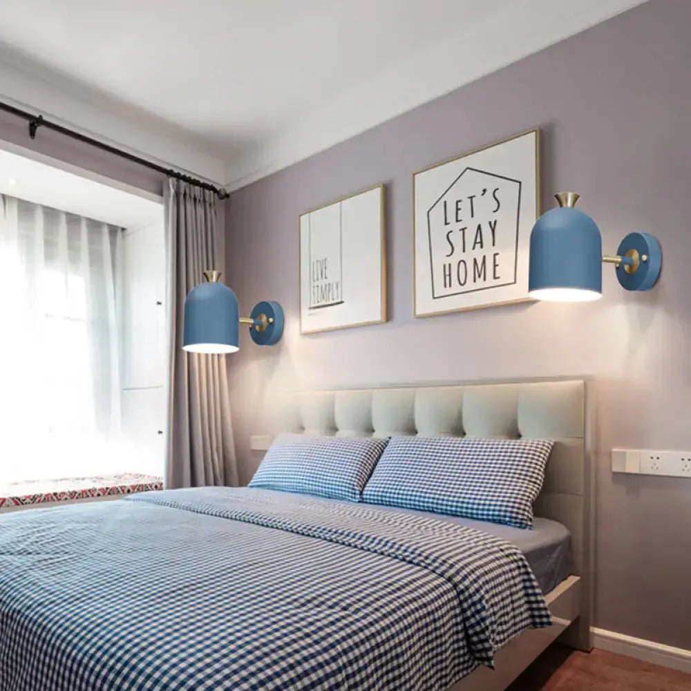 Blue dome-shaped wall light sconce lamp with brass cup shade accents designed for dining room use