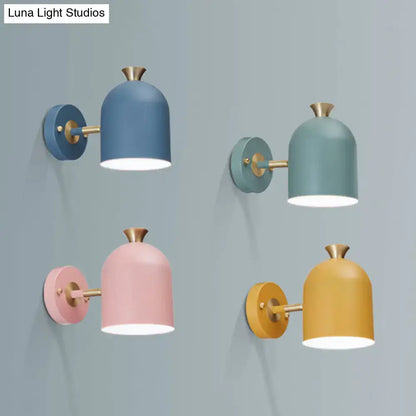 Set of four modern pastel wall light sconce lamps with cup shades and brass accents for dining room lighting