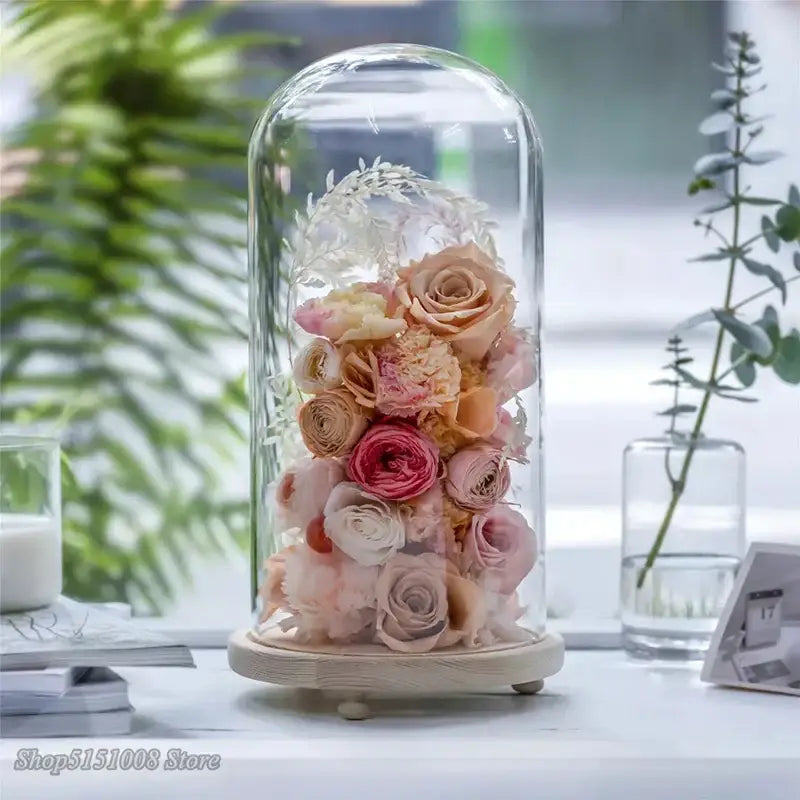 Delicate pink and cream preserved roses in a glass dome dry flower ornaments night light on wooden base
