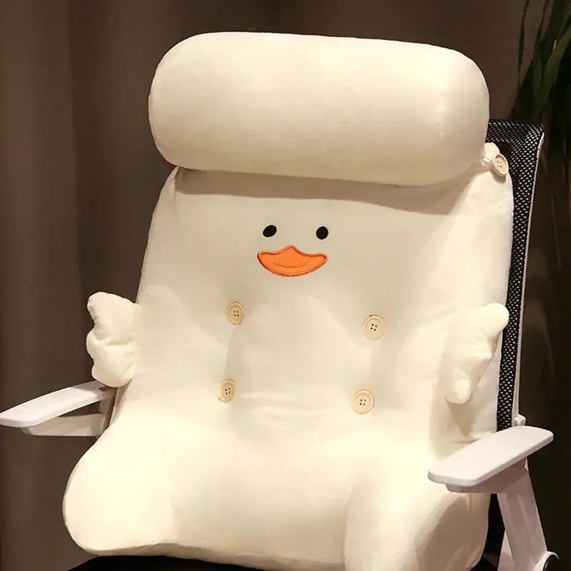 A plush white duck square dumb duck cushion with an orange beak and button details for bedroom backrest
