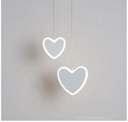 Two minimalist heart blossom butterfly led pendant lights with glowing white outlines and soft gray centers for bedroom lighting