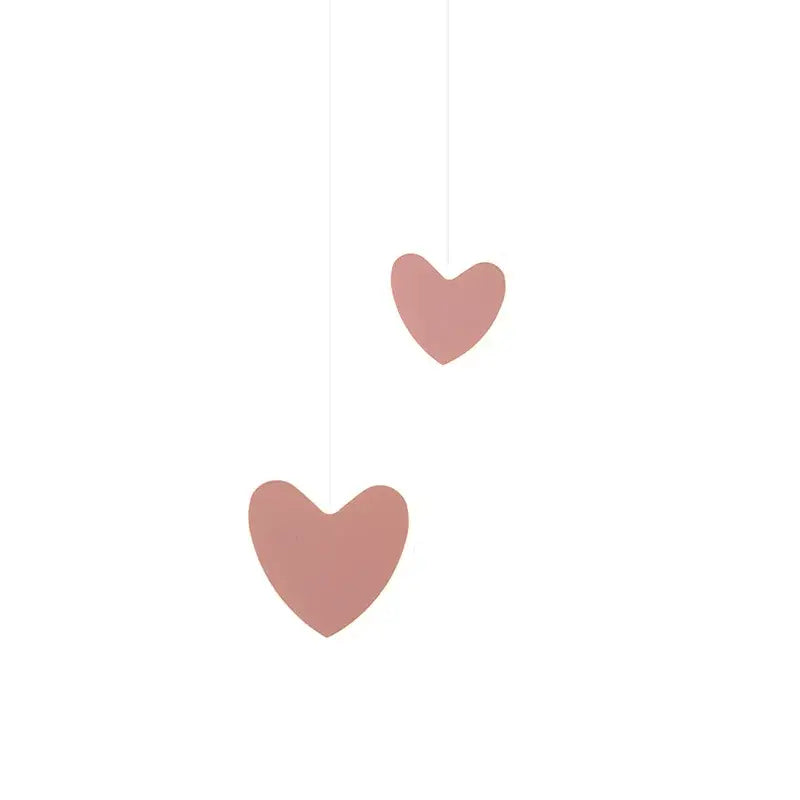 Two blush pink heart-shaped hanging ornaments featured in a pink and gray heart blossom butterfly led chandelier bedroom light