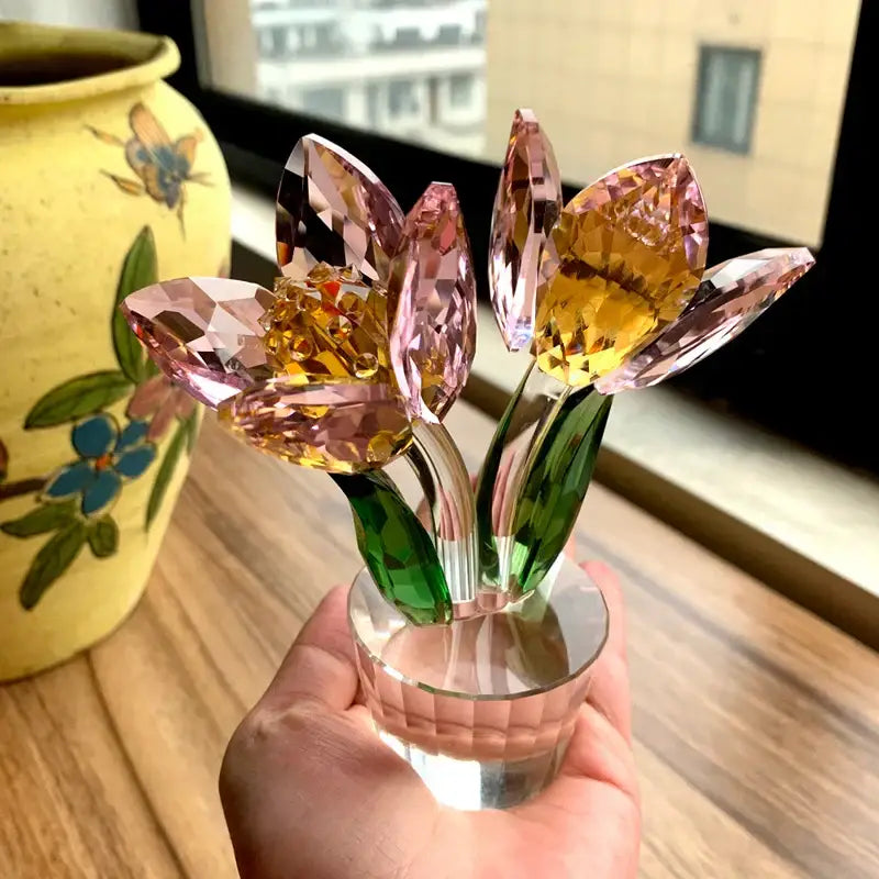 Delicate pink and green crystal tulip lily flower sculpture with faceted petals on clear glass base for living room decor