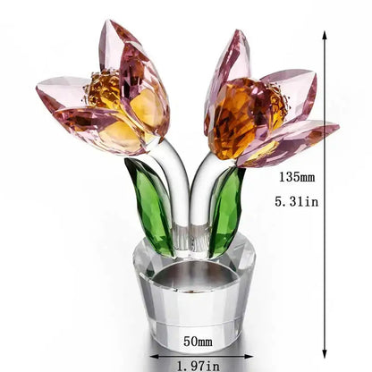 A sparkling crystal tulip lily flower sculpture with pink and amber petals and green leaves on a clear glass base decorbites crystal tulip