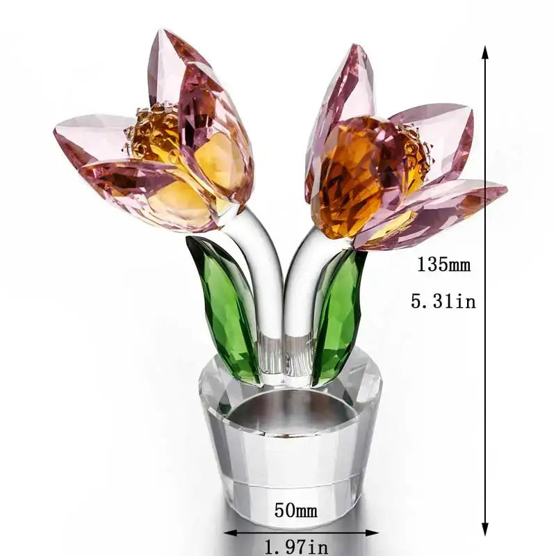 A sparkling crystal tulip lily flower sculpture with pink and amber petals and green leaves on a clear glass base decorbites crystal tulip