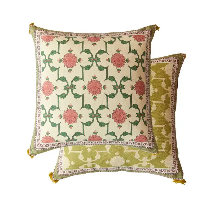 Square cushion with pink and green datura flowers print on cream background and olive-green tassel border for living room decor