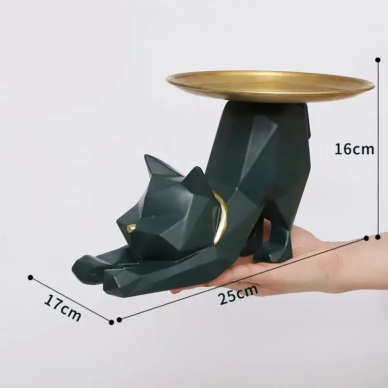 A sleek dark green geometric cat storage figurine with gold-trimmed collar and matching golden plate on back