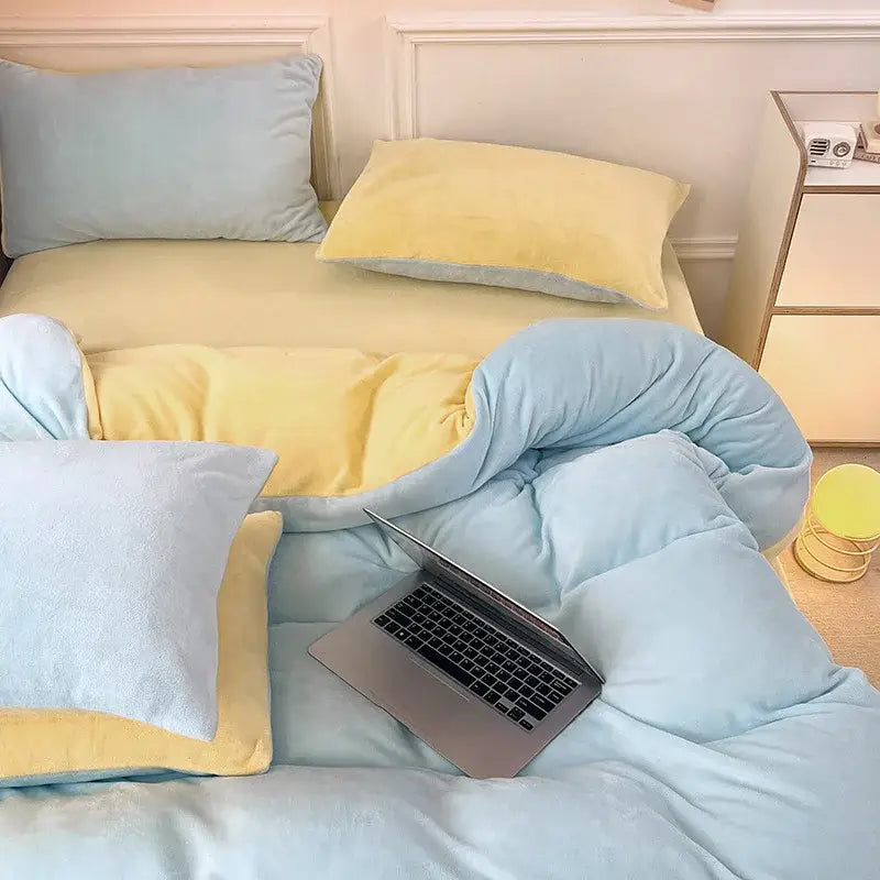 A cozy two-toned pastel blue and yellow milk velvet comforter with plush velour texture in velvet bedding sets for winter