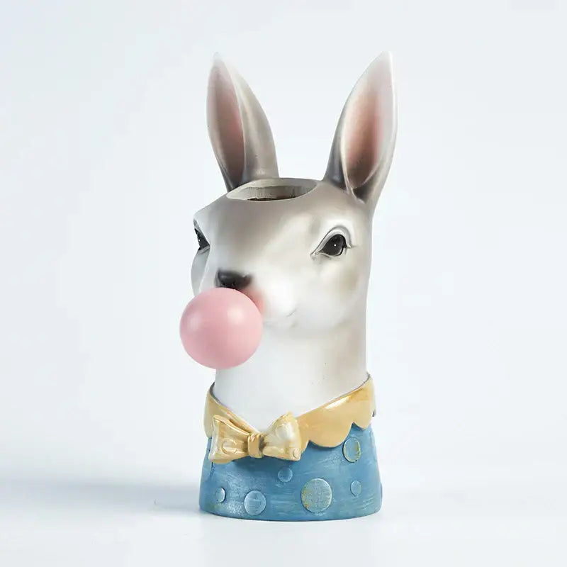 A charming resin bubble gum girl flower vase in pink and purple featuring a white rabbit figurine in decorbites bubble gum style