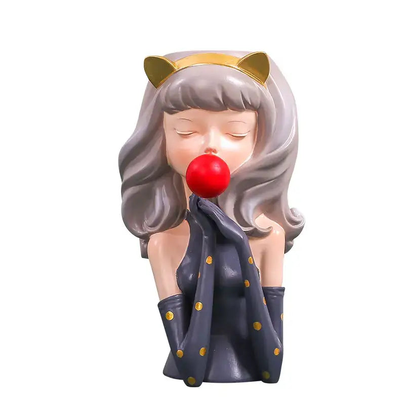 A charming gray-haired resin bubble gum girl figurine with gold cat ears and red nose in navy polka dot decorbites flower vase decor