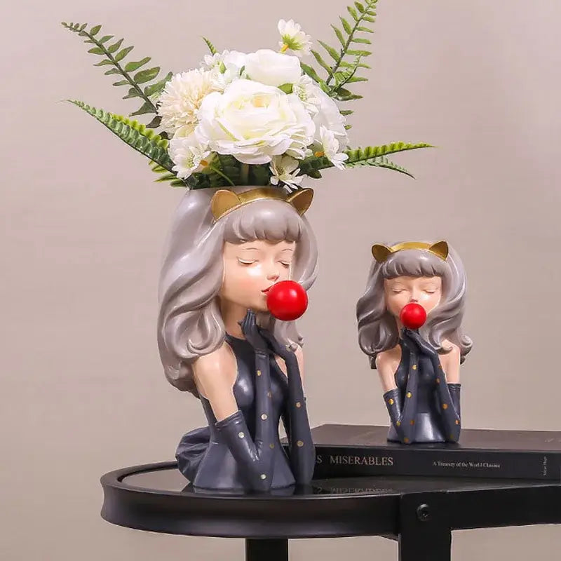 Gray resin bubble gum girl flower vase with cat ears and red nose holding white flowers for decorbites bubble gum decor