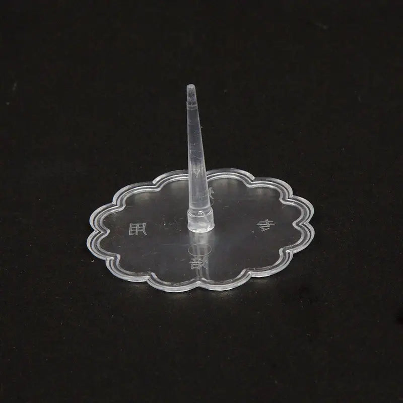 Clear plastic decorbites cake stands with scalloped base and central spike for pink and purple doll cake stands decoration