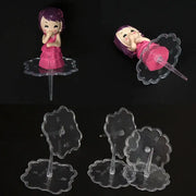 Pink and purple plastic doll cake stands decoration with purple hair on clear acrylic stand by decorbites cake stands