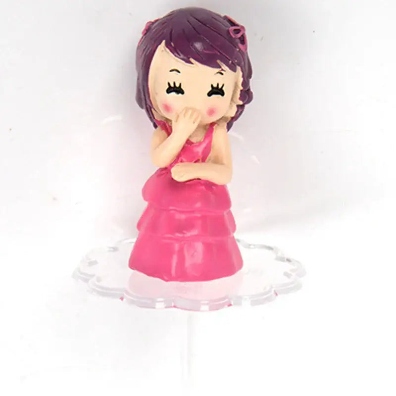 A charming pink plastic figurine of a girl with purple hair for decorbites cake stands cake stands decoration