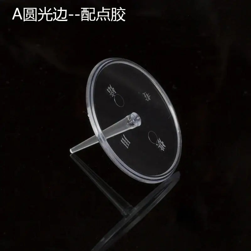 Clear acrylic circular cake stand with central stem and engraved markings for pink and purple doll cake stands decoration
