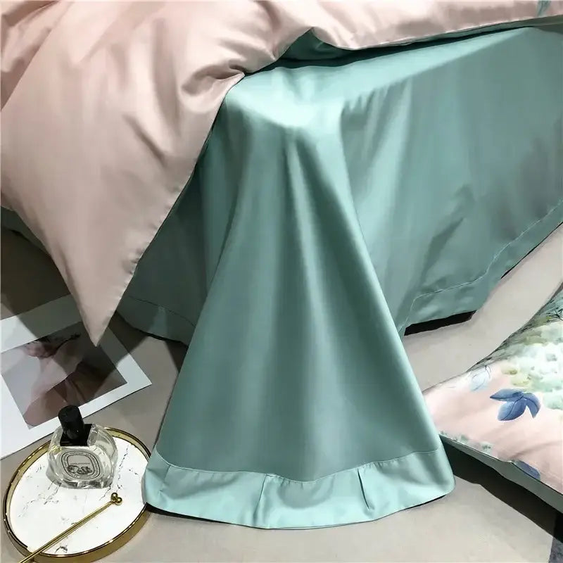 Soft mint green satin bed skirt with ruffled hem in pink and teal floral egyptian cotton bedding set