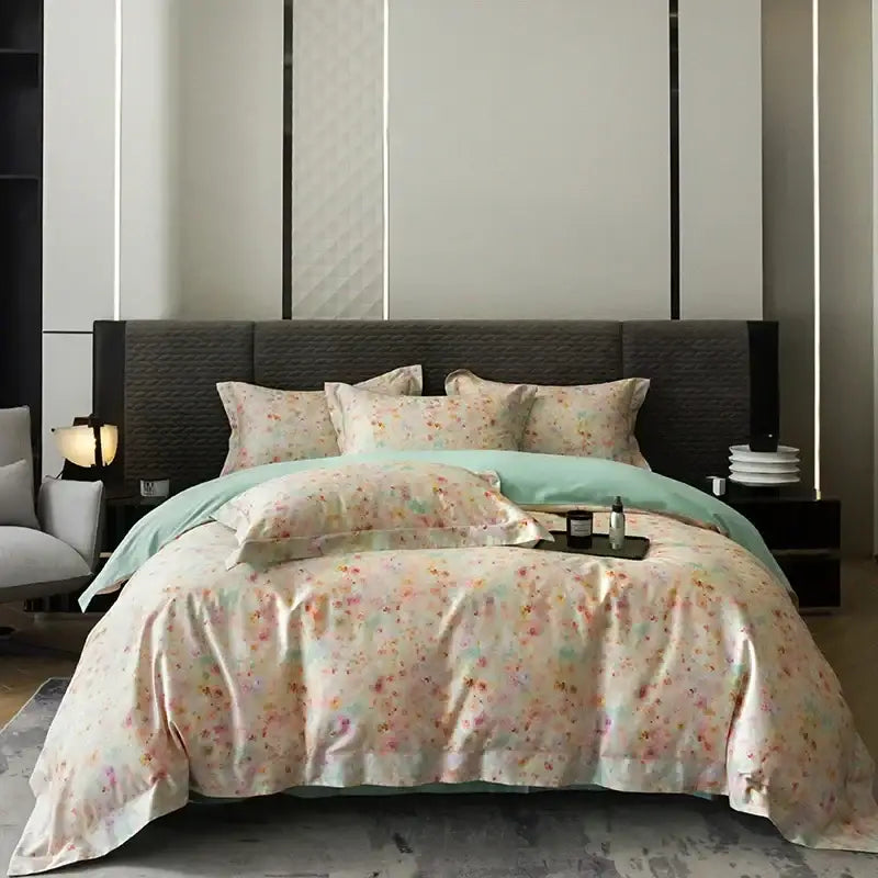Pink and teal floral egyptian cotton bedding set featuring a soft pastel duvet with pink and green blossoms on ivory