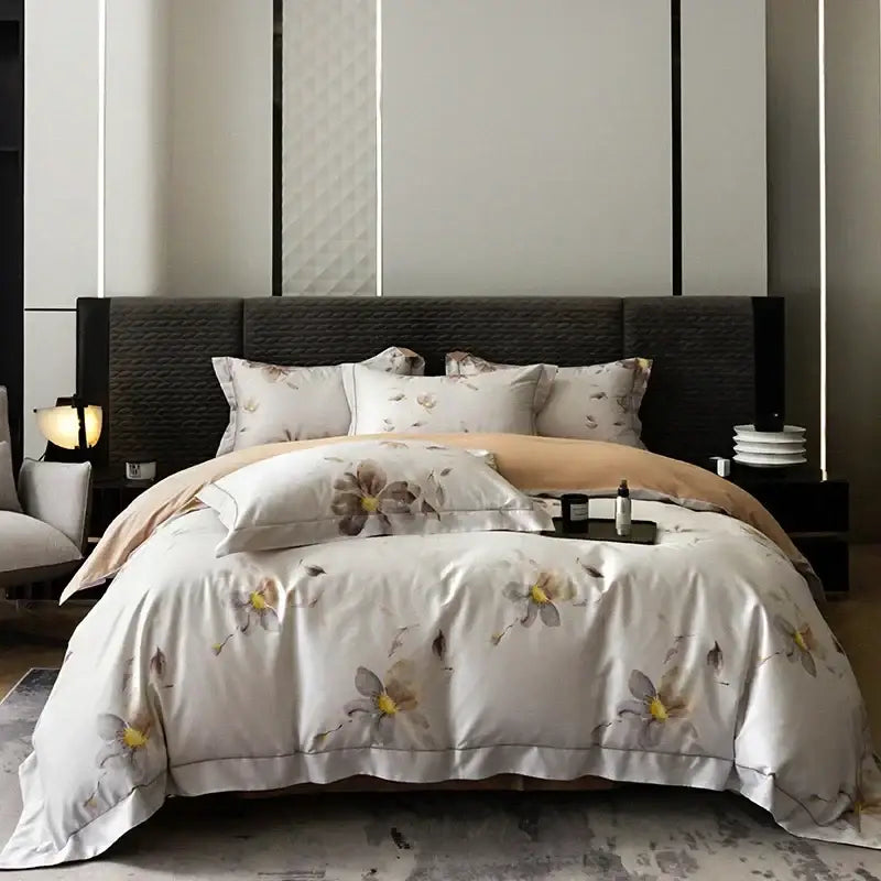 White satin duvet cover with beige and yellow floral pattern and stitched hem in pink and teal egyptian cotton bedding set