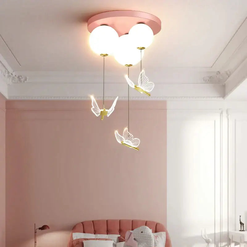 Pink and white butterfly ball ceiling lamp with three glowing globe bulbs and delicate pendant lights for bedroom decorbites butterfly ball
