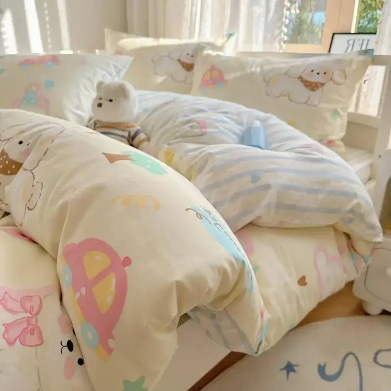 Cream-colored quilt cover with pastel pink blue and yellow decorbites cartoon printed cotton designs of dogs cars and bows