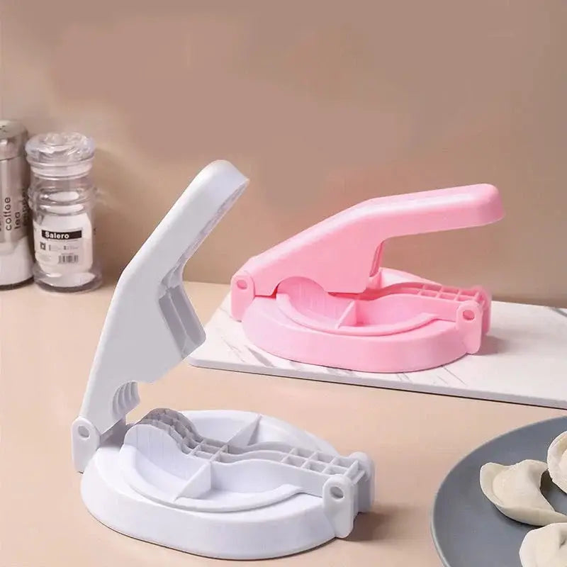Pink and white plastic dumpling wrapper presser mold with hinged lever design baking tool for kitchen use