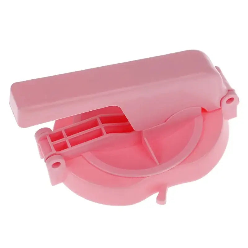 Pink plastic tortilla press with handle and circular presser mold is a baking tool for dumpling wrapper presser use