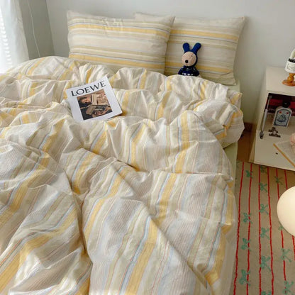 Soft cream and yellow striped duvet set with subtle blue accents from decorbites cozy cotton grid bedding sets