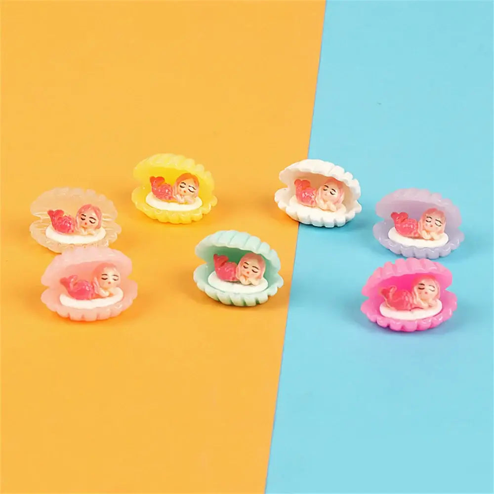 Pastel-colored decorbites colorful plated seashell figurines holding tiny sleeping mermaids for bedroom decor
