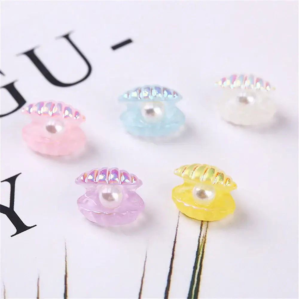 Pastel pink and white decorbites colorful plated seashells with iridescent edges and embedded pearls for bedroom decor