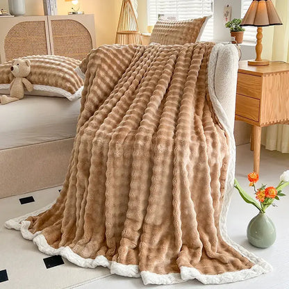 A tan plush throw blanket with textured ribbed pattern and white fleece lining from decorbites cozy faux rabbit fur collection