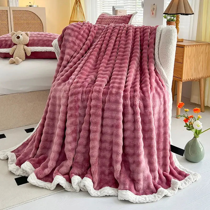 Pink and white two-sided throw blanket with textured ribbed surface made of decorbites cozy faux rabbit fur for bedroom decor