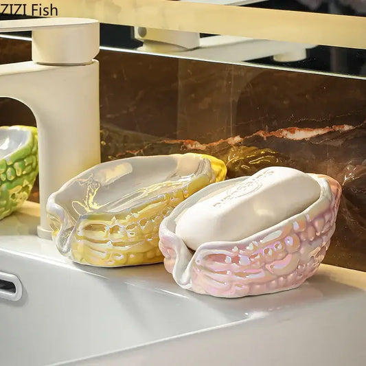 Pink and yellow bitter gourd ceramic soap dish with textured shell-like design for bathroom drainage rack