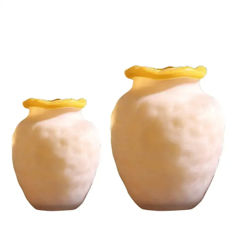 Two cream-colored textured frosted glass vases with yellow-rimmed tops for decorbites colorful frosted living room decor