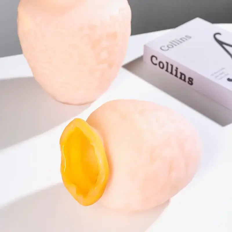 Pink and yellow textured silicone stress ball with a bright interior opening for decorbites colorful frosted glass decor