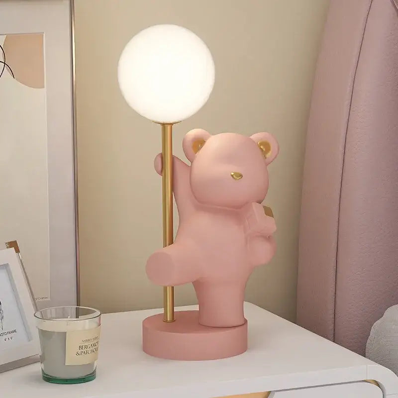 Pink bear princess desk night light featuring a bear-shaped pink lamp with gold pole and white spherical light fixture