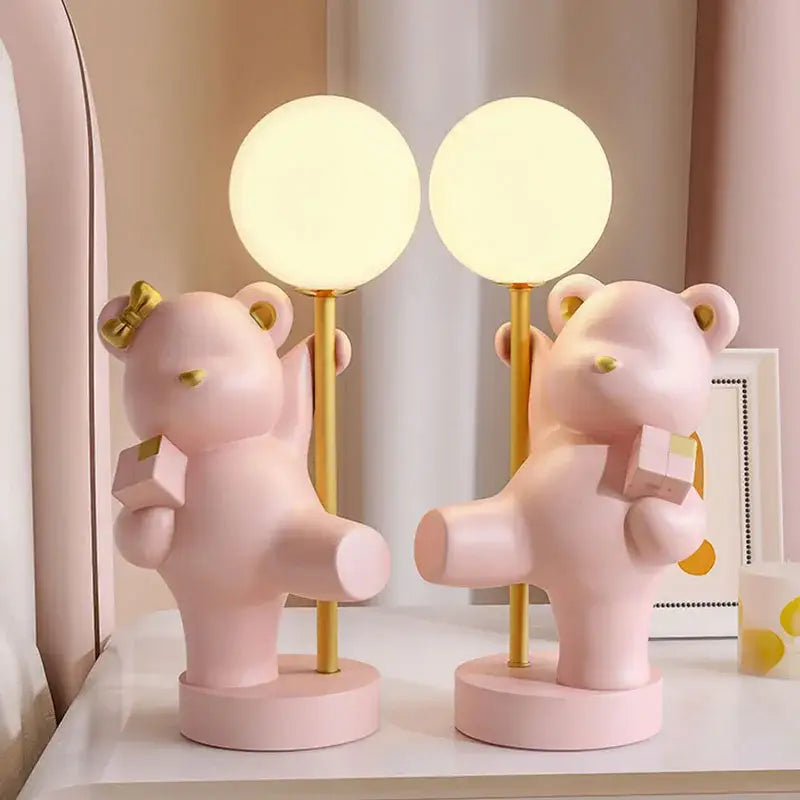 Pink bear princess desk night light featuring gold accents and frosted glass spherical shades for bedroom use