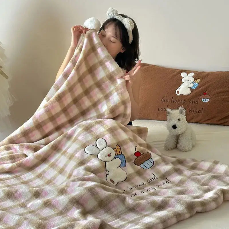 Pink and beige cartoon patch woolen blanket with fur balls featuring embroidered white bunny decorbites cupcakes