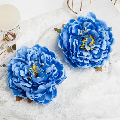 Vibrant blue artificial flowers featuring big peony headwear with layered petals and yellow centers for wedding decor