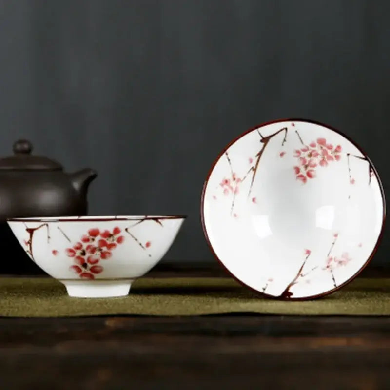 White porcelain hand-painted bowls with pink and black floral cherry blossom patterns and glossy finish from decorbites blue