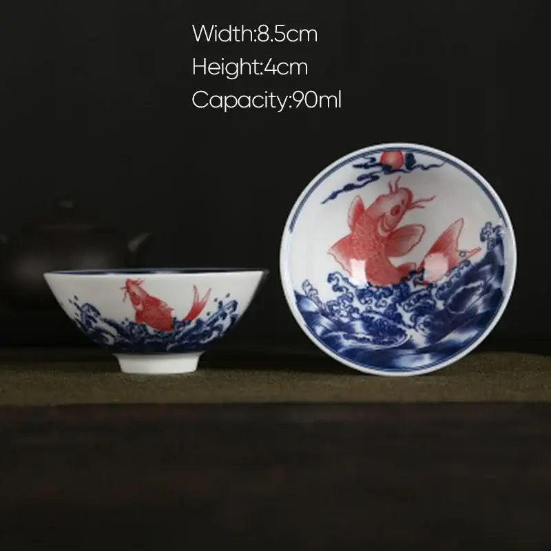 White porcelain hand-painted tea bowl with decorbites blue koi fish design in waves for dining room set