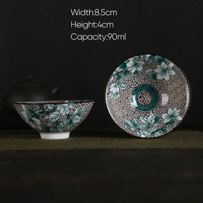 A white porcelain hand-painted ceramic bowl with green floral pattern and circular 福 emblem for decorbites blue dining set