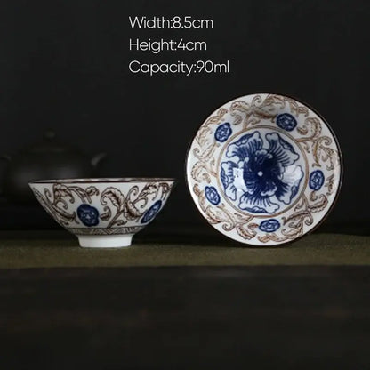 A delicate white porcelain hand-painted tea bowl with blue and brown floral patterns from decorbites blue collection