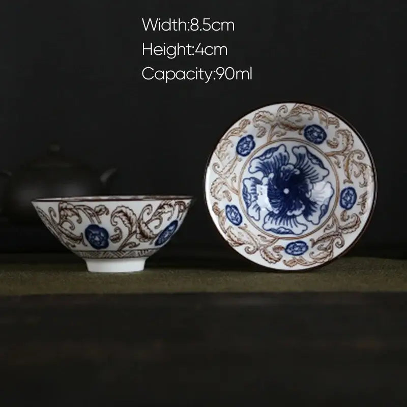 A delicate white porcelain hand-painted tea bowl with blue and brown floral patterns from decorbites blue collection
