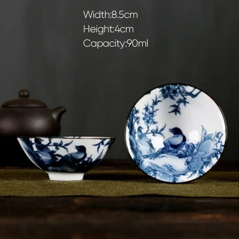 Delicate blue and white porcelain hand-painted tea bowl with birds and blossoms from decorbites white porcelain set