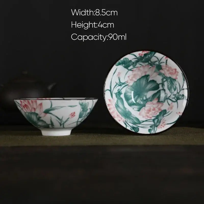 A white porcelain hand-painted tea bowl with pink lotus floral design and matching saucer from decorbites blue dining set