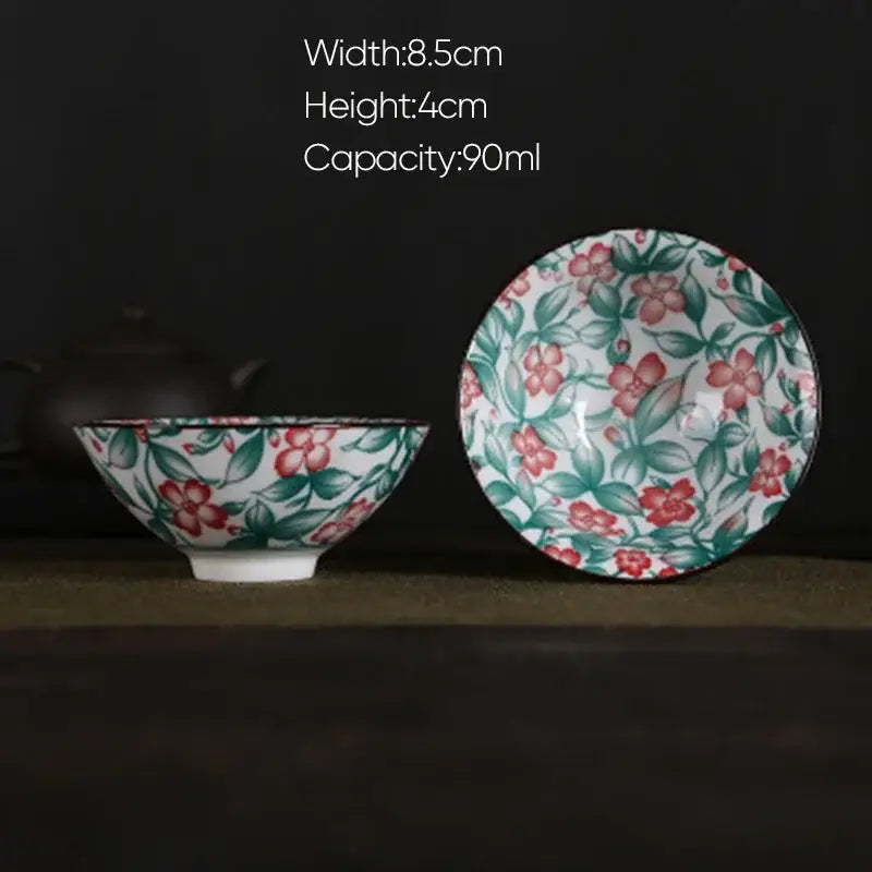 A white porcelain hand-painted bowl and saucer set featuring pink and black floral pattern for dining room decorbites blue