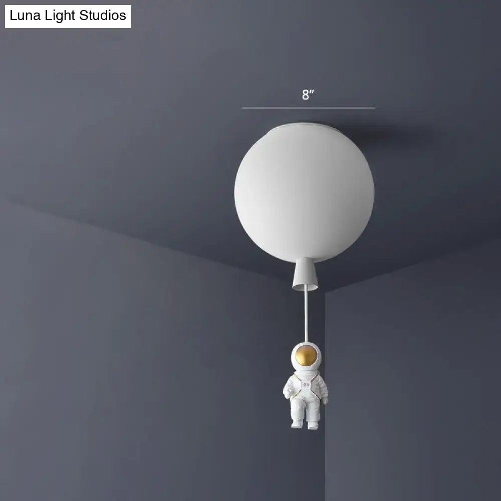 White balloon-shaped astronaut ceiling lamp with pink and blue miniature astronaut figure for bedroom pendant light