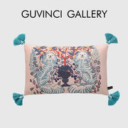 Pink rectangular lumbar pillow cover with embroidered white lion dog and blue lion vase design with teal tassels